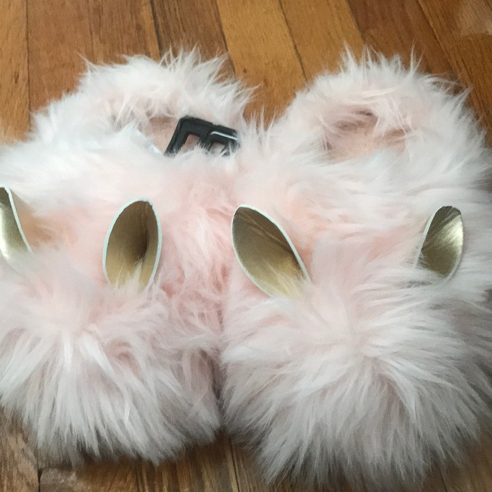 Pink fuzzy slippers with ears